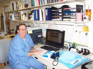 Dennis Tracy showing off some of his photos from his first trip to Bangladesh